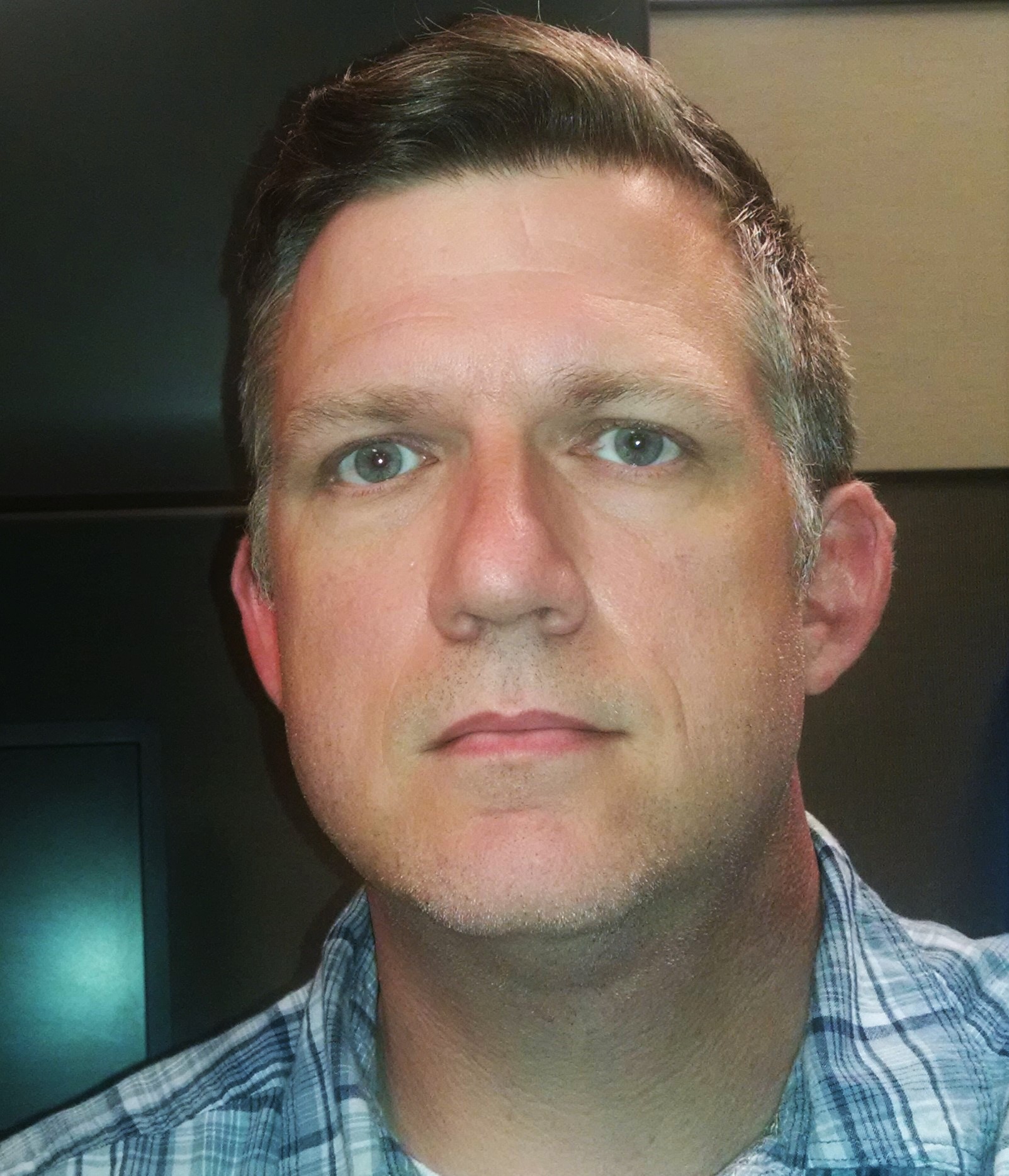 Web applications developer Anthony Alford in front of monitors